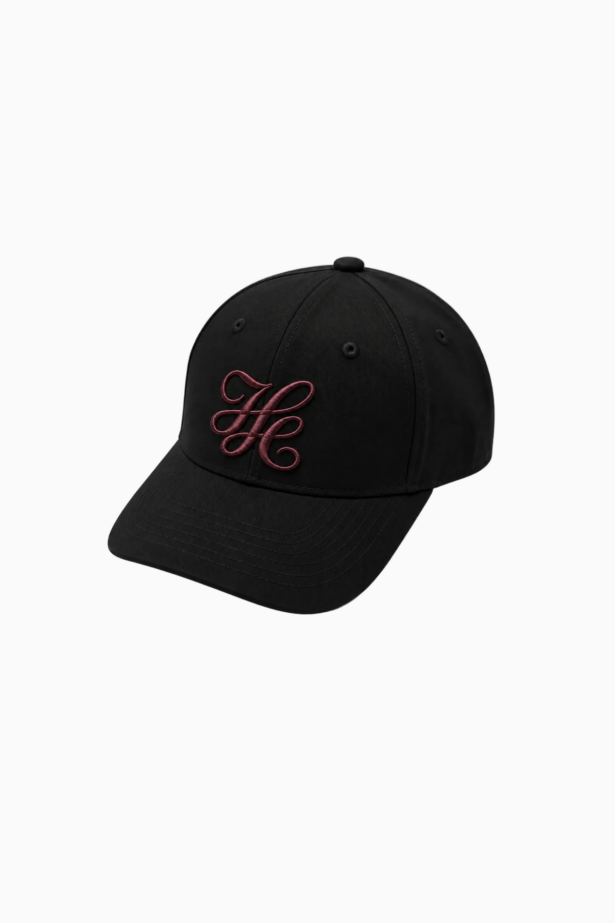 IH NOM UH NIT FW26 cotton twill cap with embroidered monogram and curved visor 