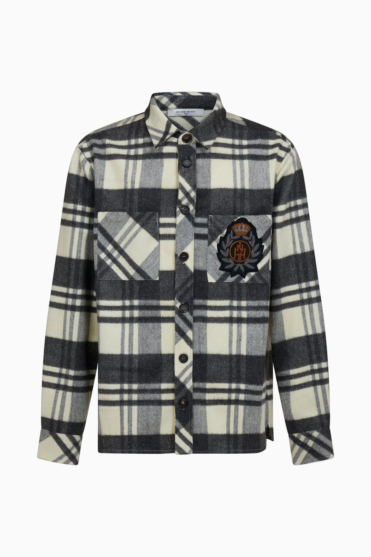 IH NOM UH NIT FW26 cream, grey and black checked overshirt with chest pockets and embroidered crest, front view