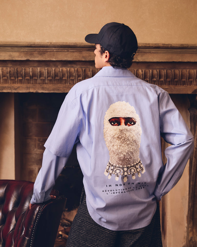 IH NOM UH NIT FW26 light blue cotton New Future Mask Bowling Shirt with open collar, front view