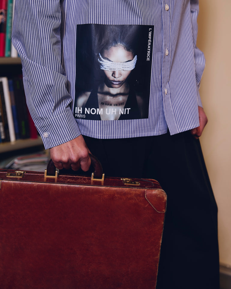 IH NOM UH NIT FW26 blue and white striped cotton shirt with IH NOM UH NIT PARIS logo across the upper back