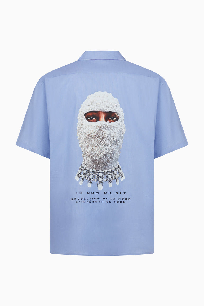 IH NOM UH NIT FW26 light blue cotton New Future Mask Bowling Shirt with masked portrait and jewelry-inspired graphic on the back